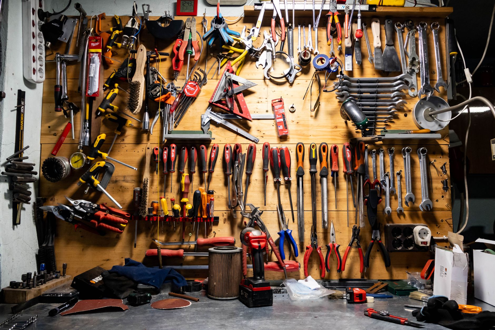 A well-organized array of tools on a workshop pegboard wall, ideal for DIY and carpentry projects.