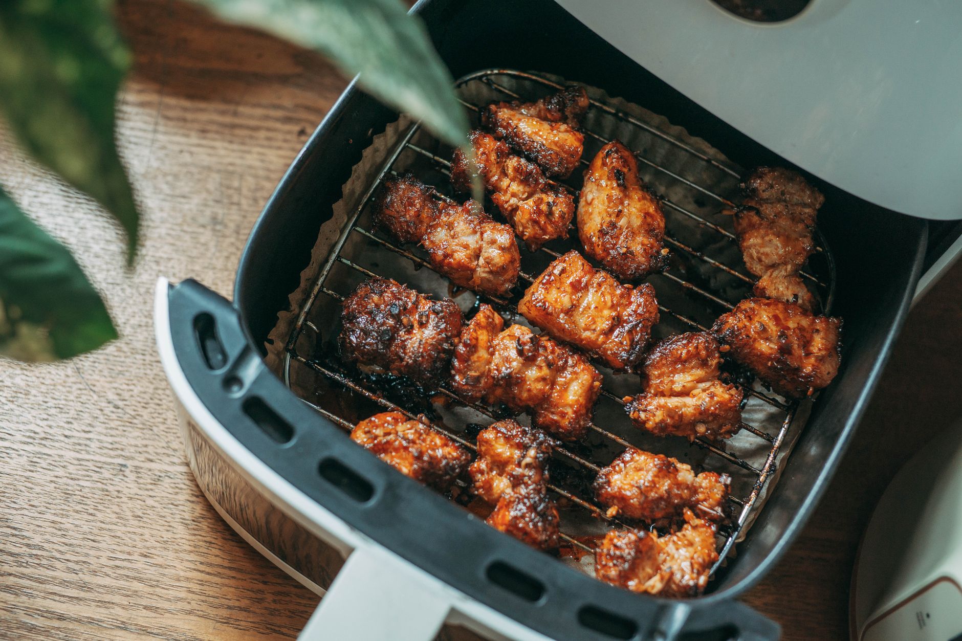 Delicious crispy chicken pieces cooked perfectly in a modern air fryer, ready to serve.